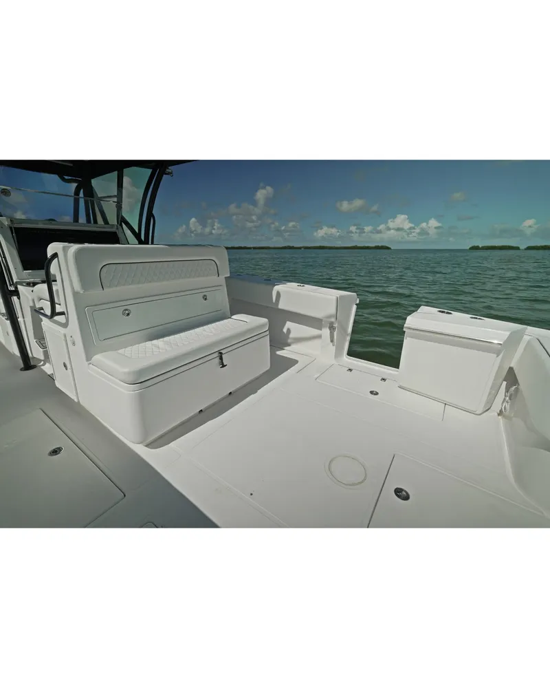 Slide: The Image of 2018 SeaHunter 39 Tournament boat interior with seating, ocean view. - 16