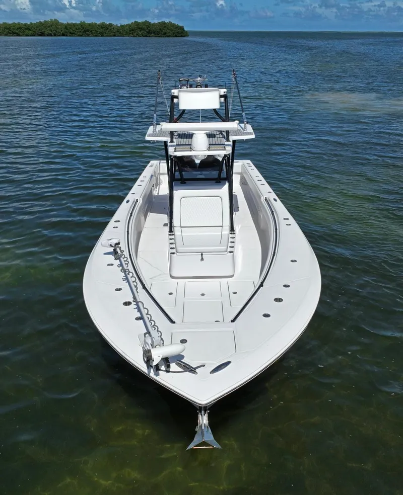 Slide: The Image of 2018 SeaHunter 39 Tournament boat on calm water, showcasing sleek design and spacious deck. - 20