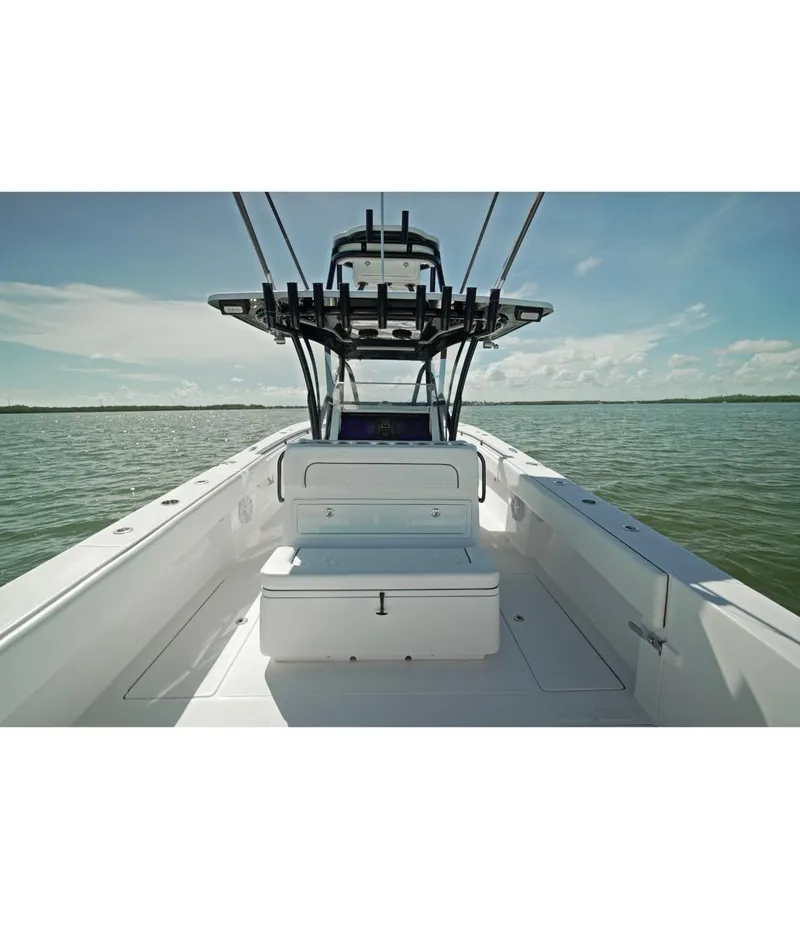 Slide: The Image of 2018 SeaHunter 39 Tournament boat on open water, clear sky, spacious deck. - 26