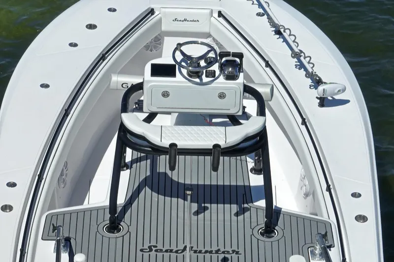 Slide: The Image of 2018 SeaHunter 39 Tournament boat cockpit with steering wheel and controls. - 27