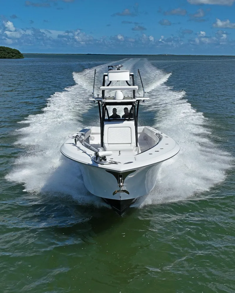 Slide: The Image of 2018 SeaHunter 39 Tournament boat cruising on open water under clear skies. - 5