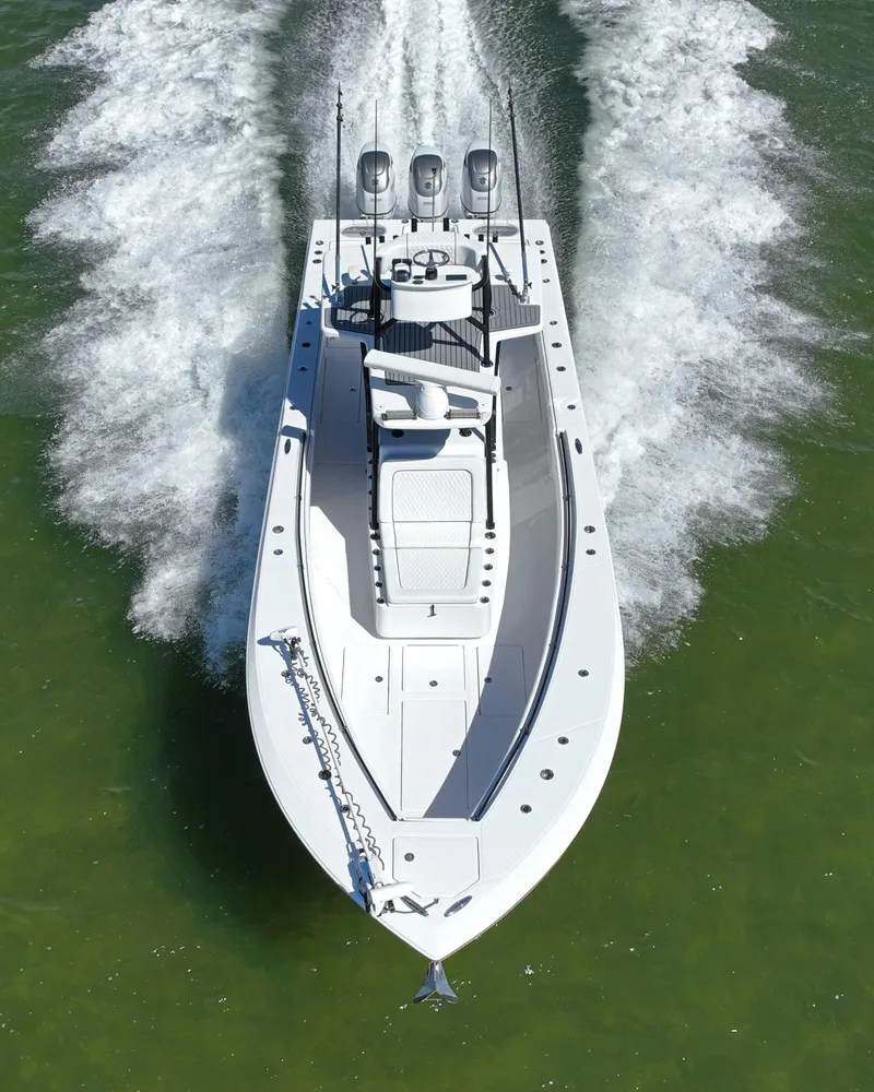 Slide: The Image of 2018 SeaHunter 39 Tournament boat cruising on open water, aerial view. - 7