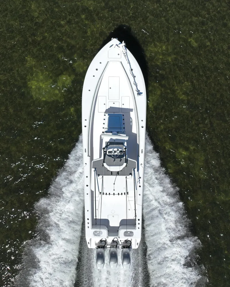 Slide: The Image of Aerial view of 2018 SeaHunter 39 Tournament boat cruising on water. - 9