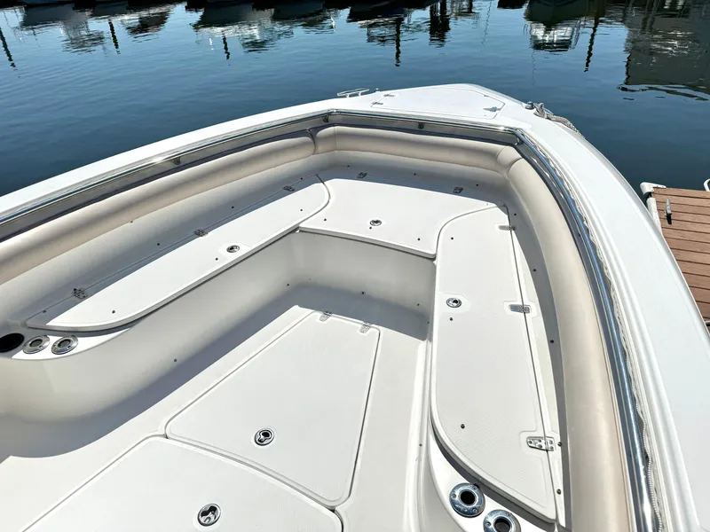 Slide: The Image of 2007 Boston Whaler 320 Outrage boat interior, featuring spacious seating and storage. - 21