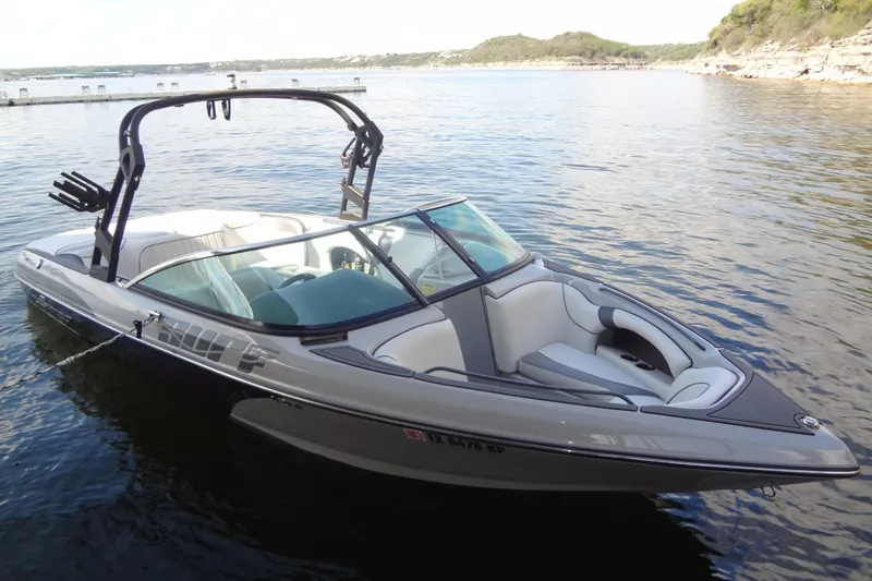 The Image of 2022 Sanger V237 S boat on calm water, featuring sleek design and modern amenities. - 0