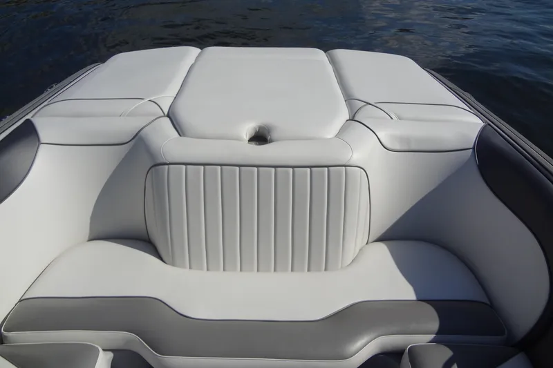 Slide: The Image of 2022 Sanger V237 S boat interior with white and gray cushioned seating. - 16