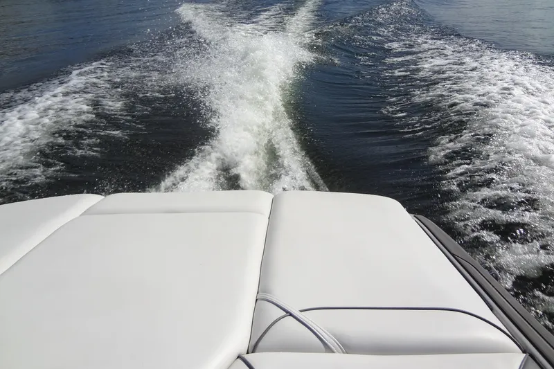 Slide: The Image of Wake behind a 2022 Sanger V237 S boat on a sunny day. - 18