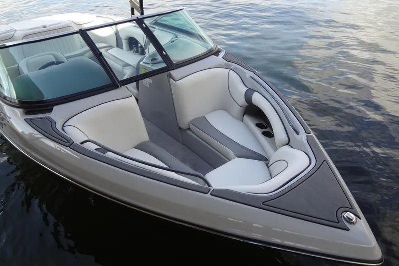 Slide: The Image of 2022 Sanger V237 S boat with sleek interior design on calm water. - 2