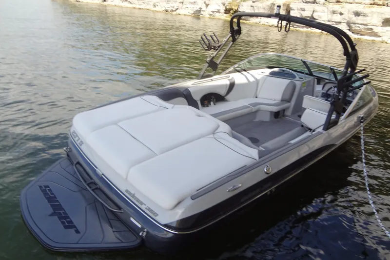 Slide: The Image of 2022 Sanger V237 S boat on water, featuring sleek design and spacious seating. - 3