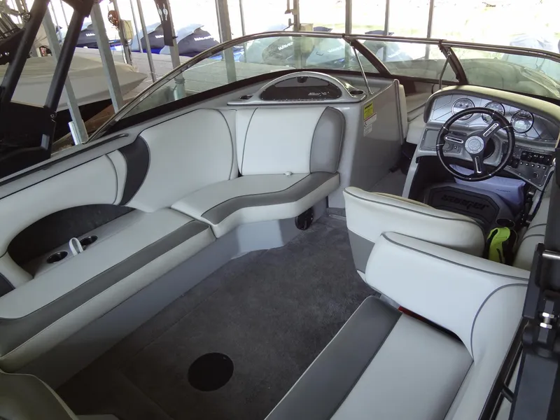Slide: The Image of 2022 Sanger V237 S boat interior with sleek seating and modern dashboard. - 30