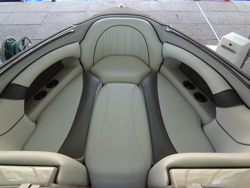 Slide: The Image of 2022 Sanger V237 S boat interior with gray seating and cup holders. - 31