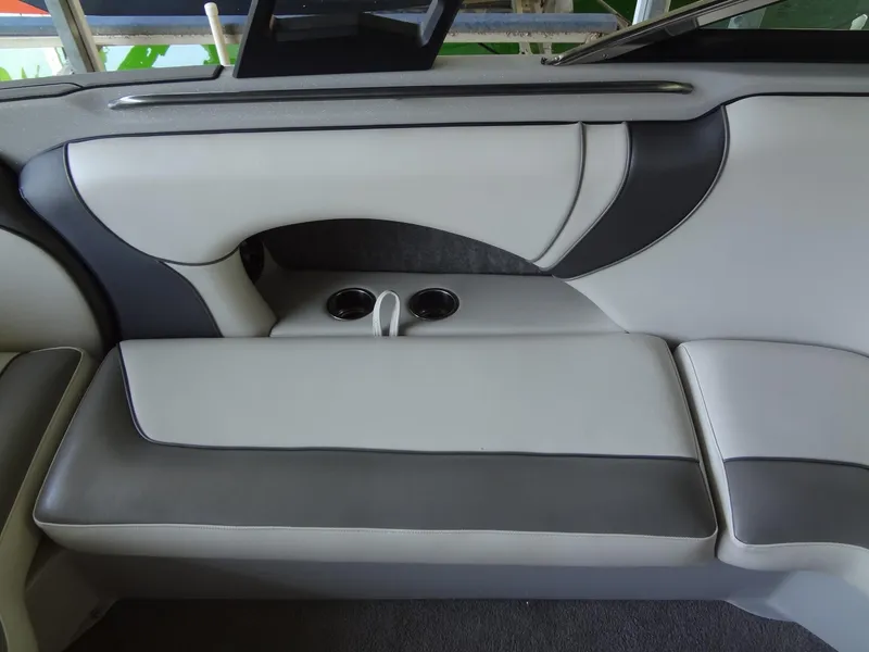 Slide: The Image of 2022 Sanger V237 S boat interior with sleek gray and white seating and cup holders. - 33