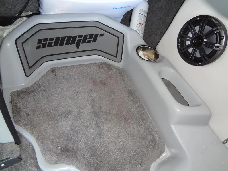 Slide: The Image of Sanger V237 S 2022 boat interior with speaker and carpeted flooring. - 40