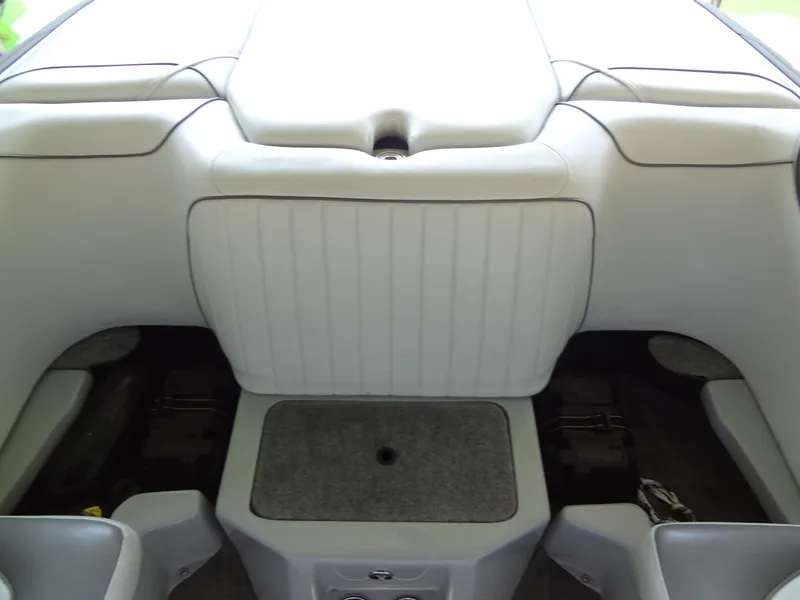 Slide: The Image of 2022 Sanger V237 S boat interior, featuring sleek white seating and storage compartments. - 41