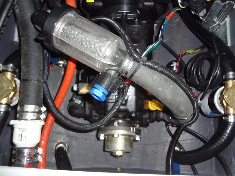 Slide: The Image of Engine compartment of 2022 Sanger V237 S with visible hoses and wiring. - 47