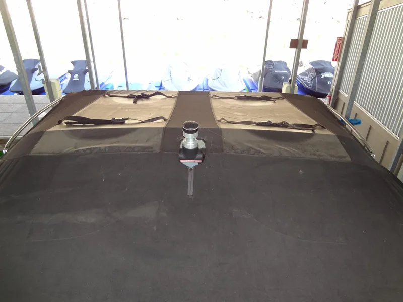 Slide: The Image of 2022 Sanger V237 S boat with covered deck in storage. - 49