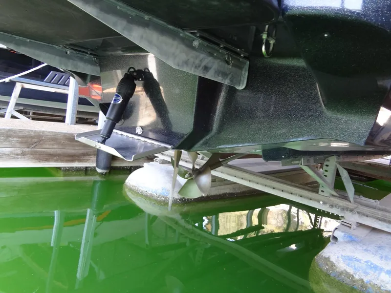 Slide: The Image of 2022 Sanger V237 S boat hull and propeller in green water. - 50