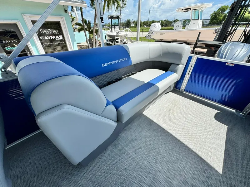 Slide: The Image of 2024 Bennington 22 SSR-SPS boat interior with blue and gray seating. - 10