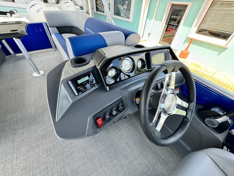 Slide: The Image of 2024 Bennington 22 SSR-SPS boat interior with modern dashboard and steering wheel. - 18