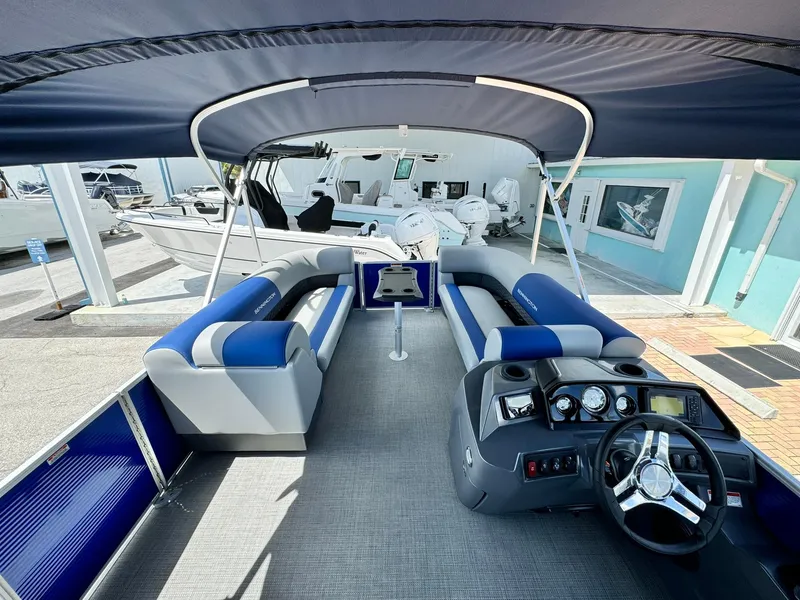 Slide: The Image of 2024 Bennington 22 SSR-SPS pontoon boat interior with blue and gray seating. - 19