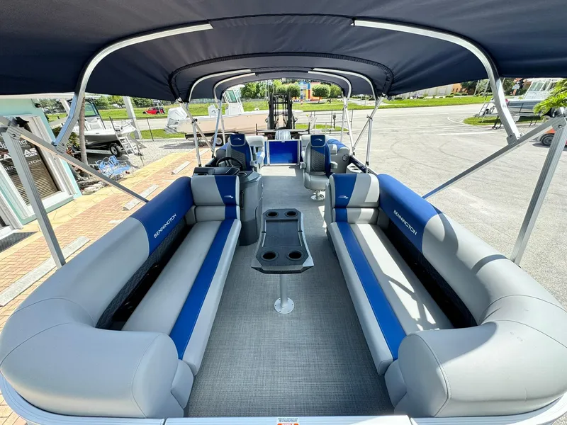 Slide: The Image of 2024 Bennington 22 SSR-SPS pontoon boat with spacious seating and canopy. - 23