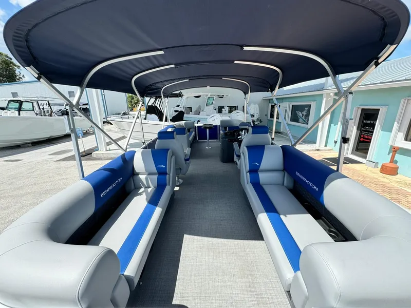 Slide: The Image of 2024 Bennington 22 SSR-SPS pontoon boat with spacious seating and canopy. - 9