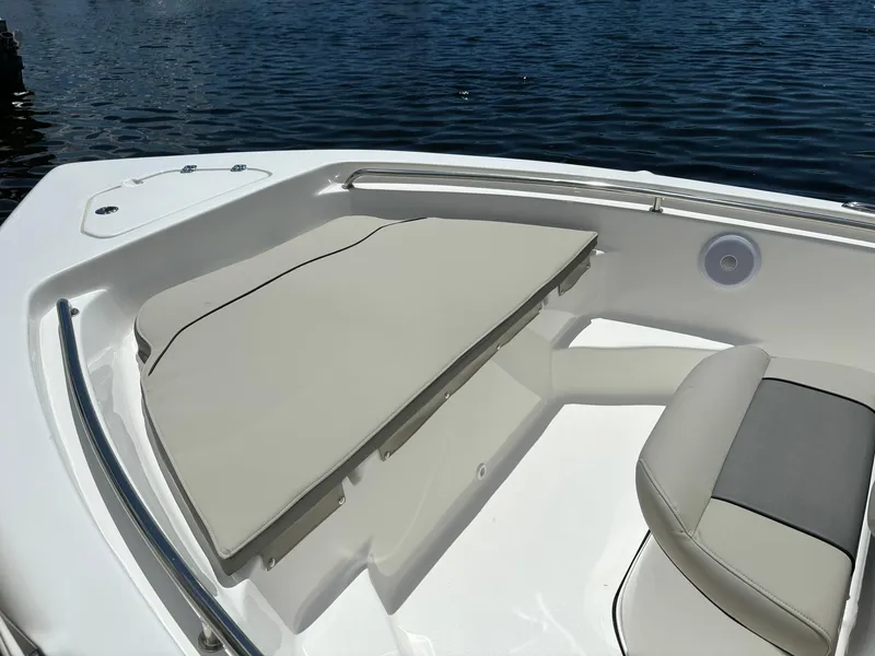 Slide: The Image of 2025 Key West 189 FS boat interior with cushioned seating and water view. - 7
