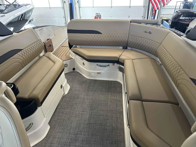 Slide: The Image of 2025 Sea Ray 280SLX boat interior with tan leather seating and modern design. - 11