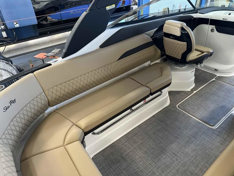 Slide: The Image of Luxurious interior of 2025 Sea Ray 280SLX boat with beige seating and modern design. - 6
