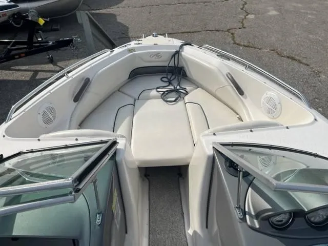 Slide: The Image of 2005 Monterey 194 FS boat interior with seating and open windshield. - 10