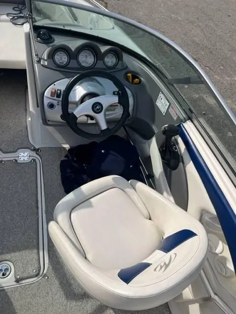 Slide: The Image of 2005 Monterey 194 FS boat interior with steering wheel and dashboard controls. - 7