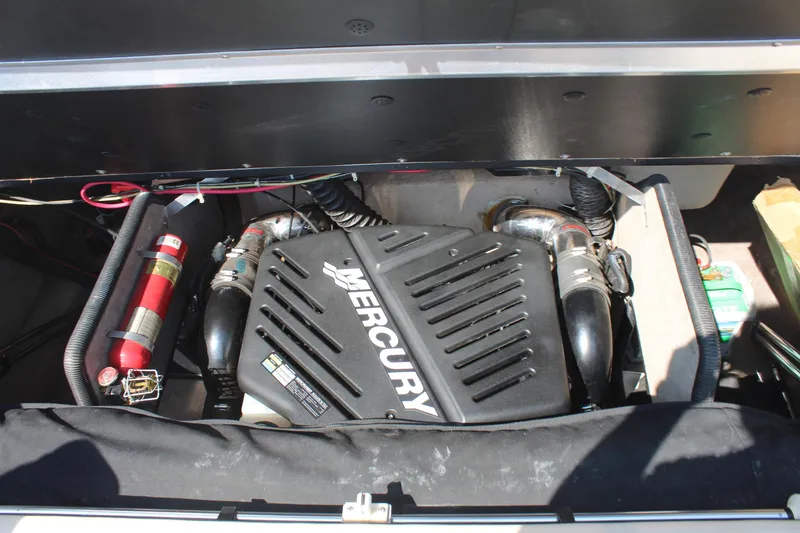 Slide: The Image of Mercury engine in 2002 Bryant 234 boat, with visible fire extinguisher. - 10