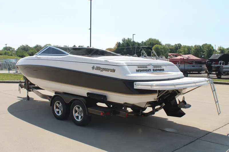 Slide: The Image of 2002 Bryant 234 boat on trailer, parked outdoors, sunny day. - 5