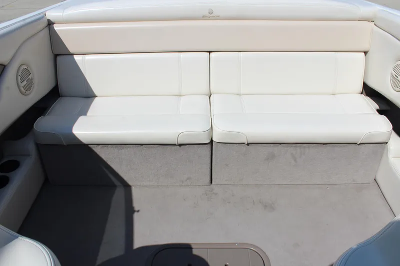 Slide: The Image of White leather seating on a 2002 Bryant 234 boat interior. - 9