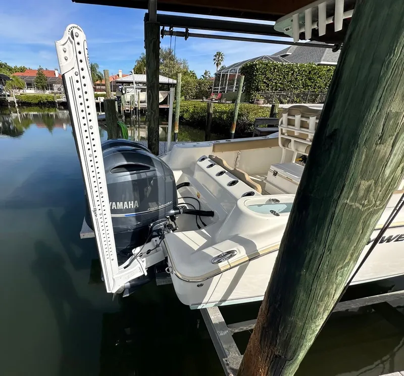 Slide: The Image of 2019 Key West 244 Center Console boat docked with Yamaha outboard motor. - 10
