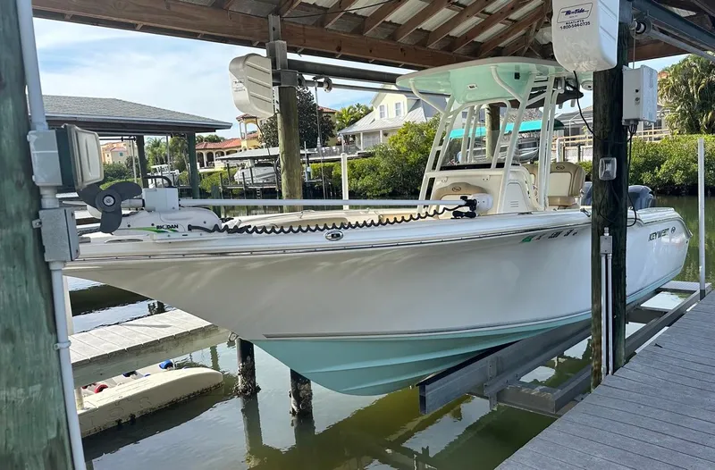 Slide: The Image of 2019 Key West 244 Center Console boat docked in a marina. - 11