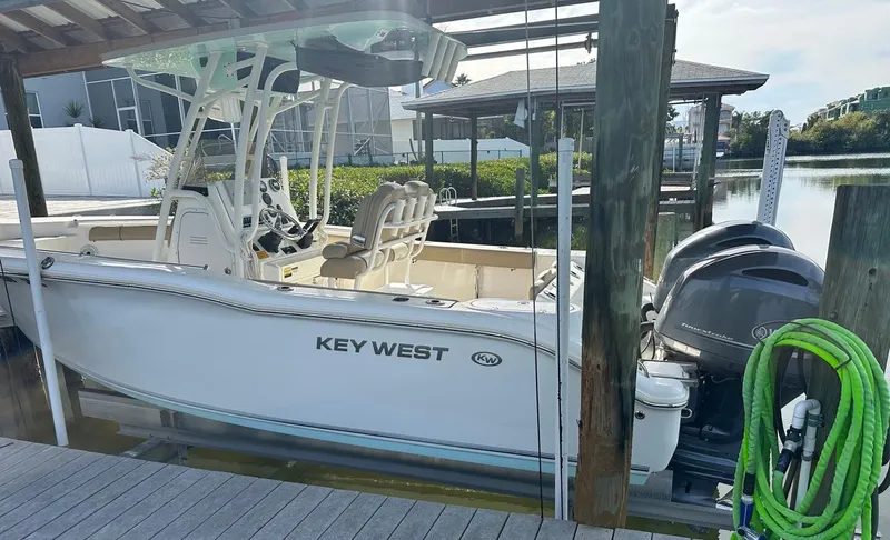 Slide: The Image of 2019 Key West 244 Center Console boat docked with dual engines. - 13