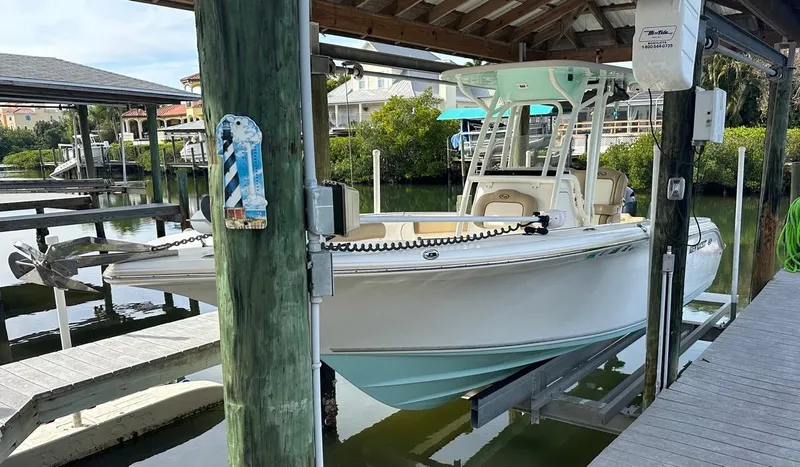 Slide: The Image of 2019 Key West 244 Center Console boat docked in a marina. - 15