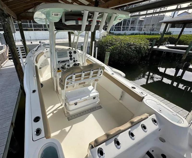 Slide: The Image of 2019 Key West 244 Center Console boat docked in marina. - 16