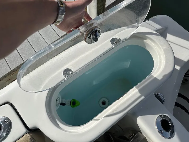 Slide: The Image of Livewell on 2019 Key West 244 Center Console boat, open lid, ready for fishing. - 20