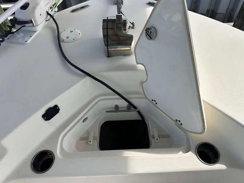 Slide: The Image of 2019 Key West 244 Center Console boat anchor compartment with open hatch. - 23