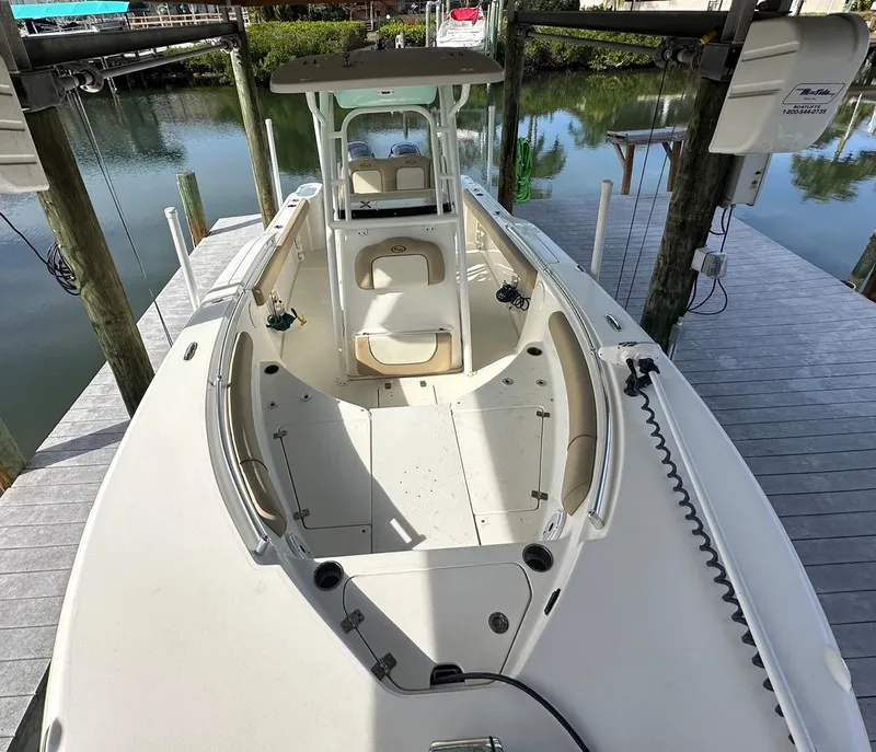 Slide: The Image of 2019 Key West 244 Center Console boat docked by the water. - 26
