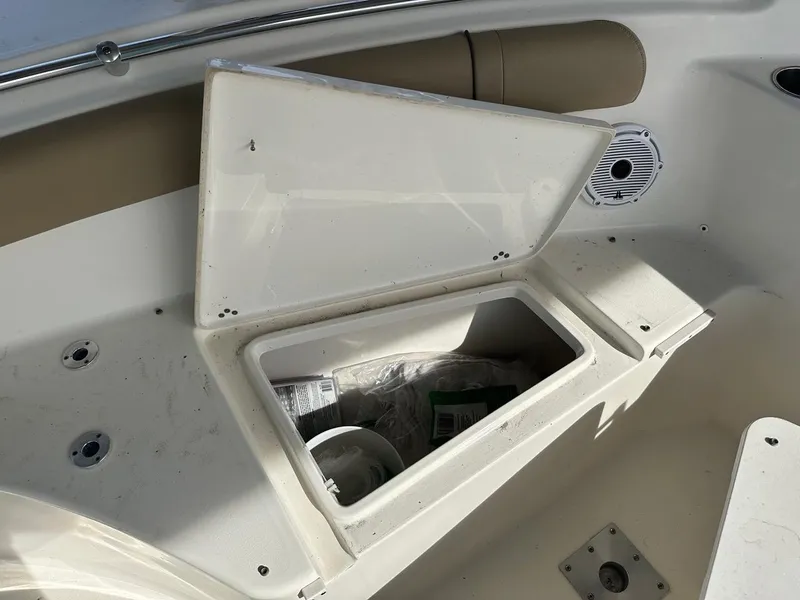 Slide: The Image of Open storage compartment on 2019 Key West 244 Center Console boat. - 27