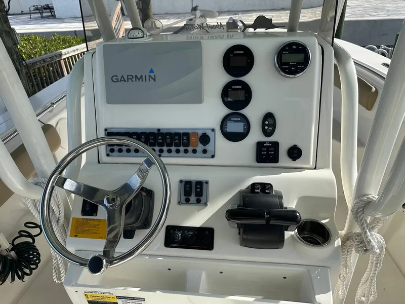 Slide: The Image of 2019 Key West 244 Center Console boat dashboard with Garmin navigation system. - 34