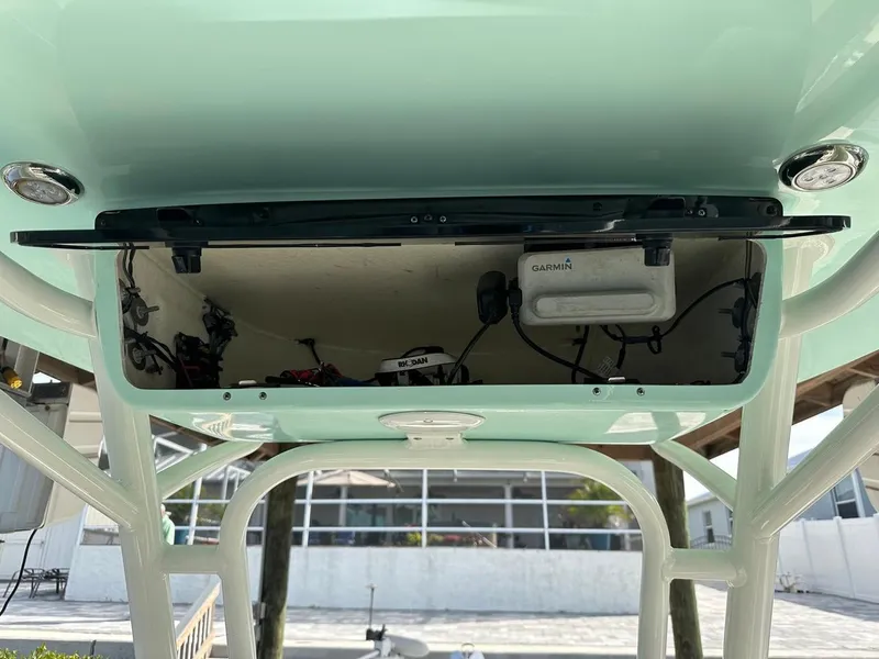 Slide: The Image of 2019 Key West 244 Center Console boat electronics compartment with Garmin device. - 35