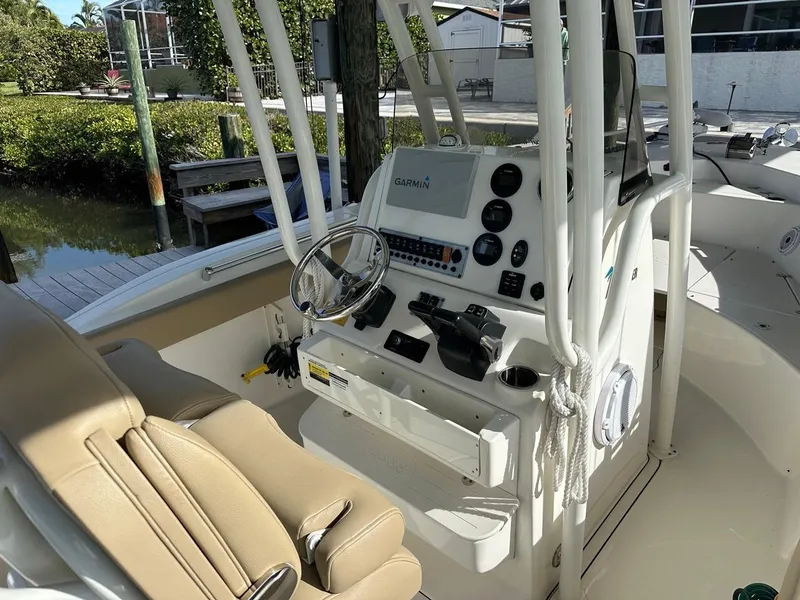Slide: The Image of 2019 Key West 244 Center Console boat interior with steering wheel and controls. - 36