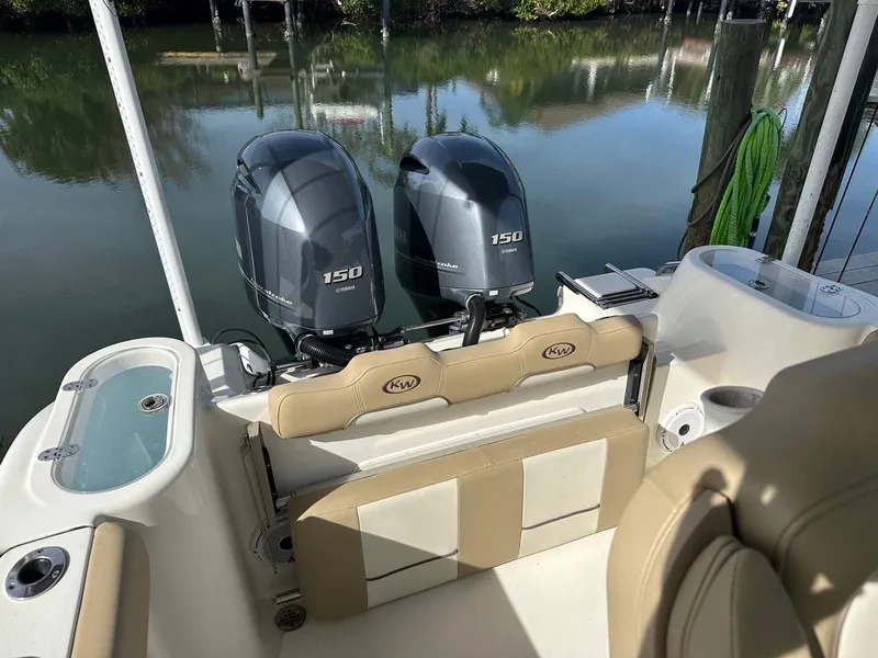Slide: The Image of 2019 Key West 244 Center Console boat with twin 150 horsepower engines. - 37