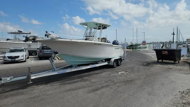 Slide: The Image of 2019 Key West 244 Center Console boat on trailer at marina. - 45
