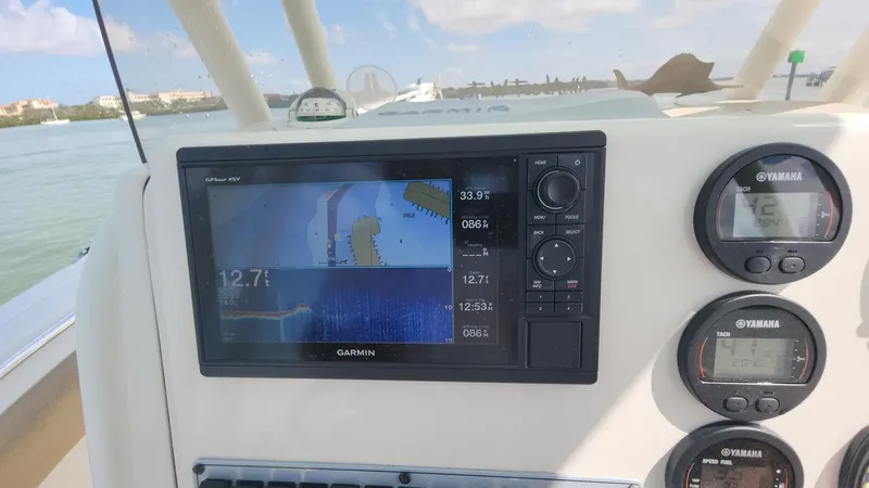 Slide: The Image of Garmin navigation system on 2019 Key West 244 Center Console boat dashboard. - 47