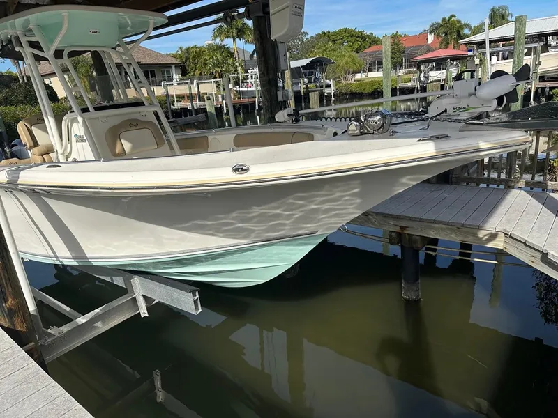 Slide: The Image of 2019 Key West 244 Center Console boat docked in marina. - 5